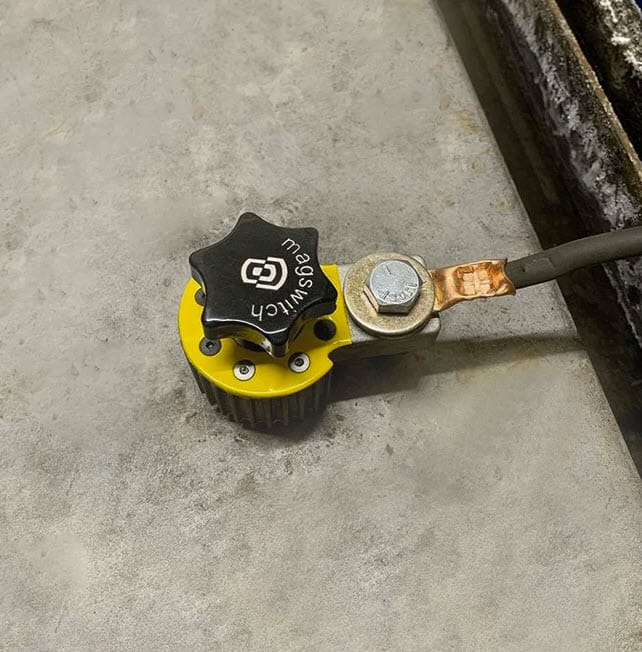 Magswitch magnetic ground clamp attached to a metal surface