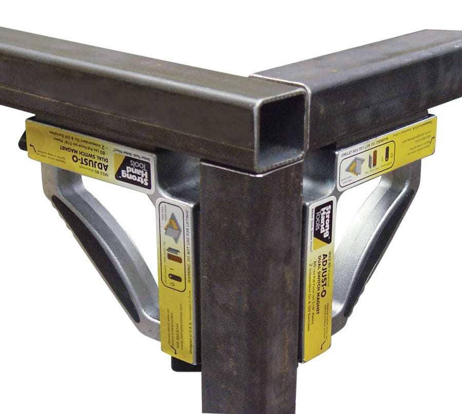 Strong Hand Adjust-O dual switch magnets holding two metal square tubes at a ninety degree angle
