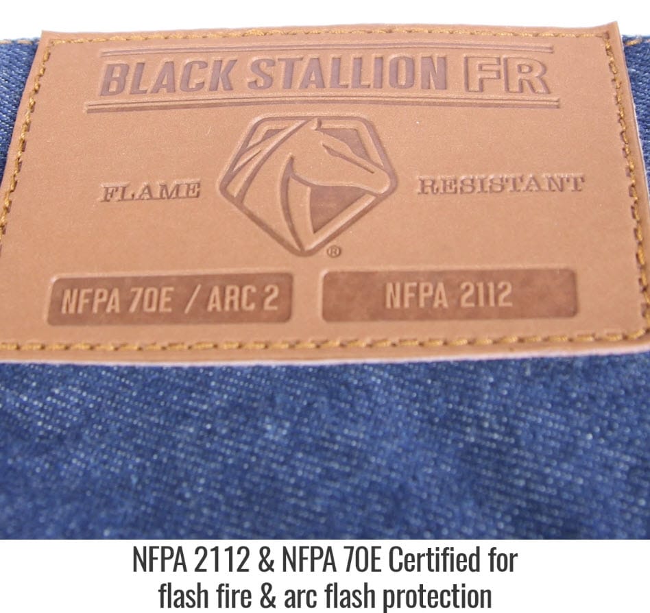 Black Stallion FR leather patch on blue denim fabric with NFPA 70E and NFPA 2112 safety certification labels