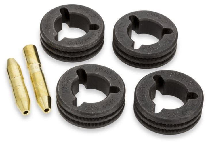 Four black circular drive rollers and two brass guide pins