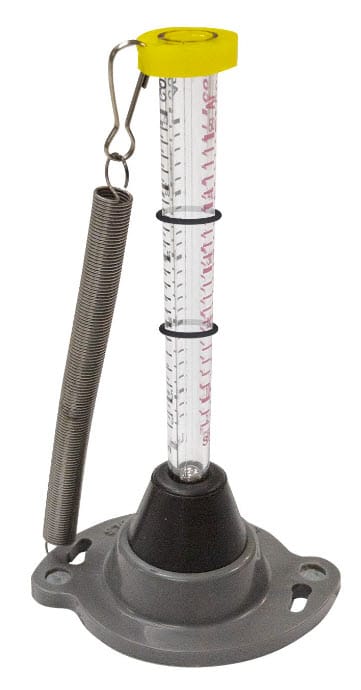 Strong Hand vertical magnetic base with a clear graduated tube and attached tension spring