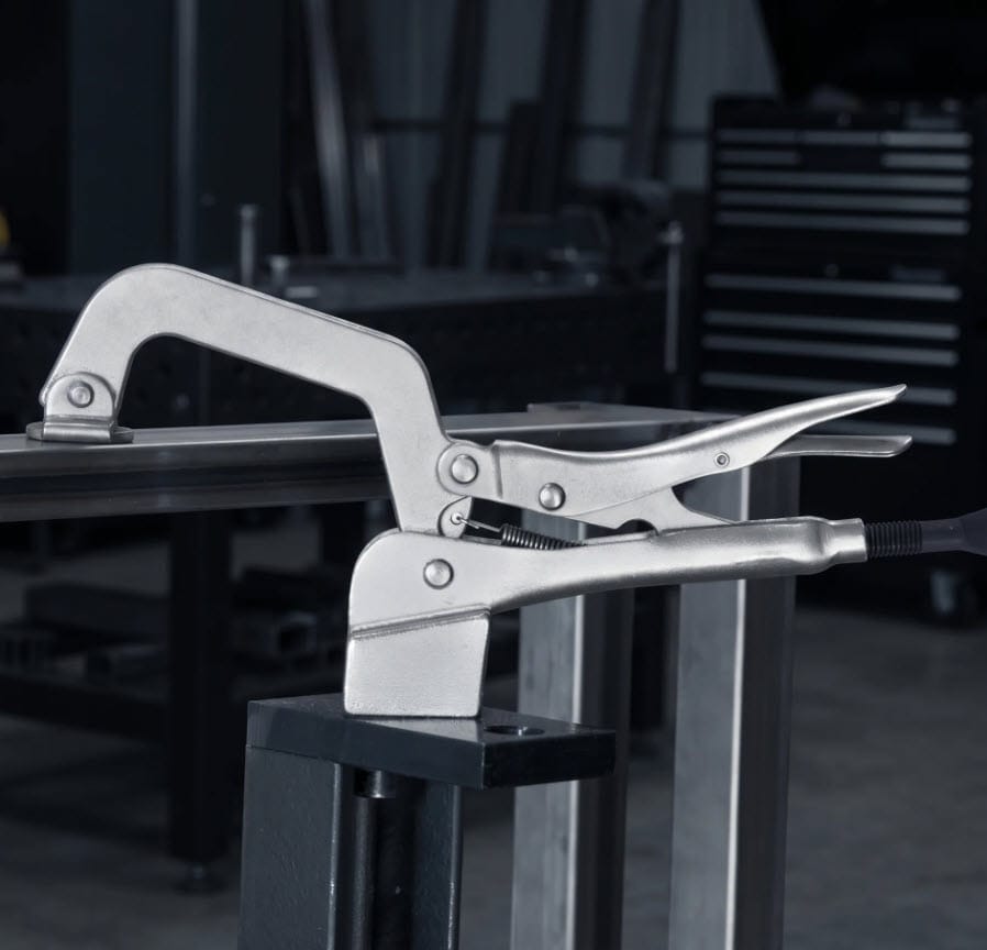 BuildPro locking C-clamp securing metal pieces on a workbench