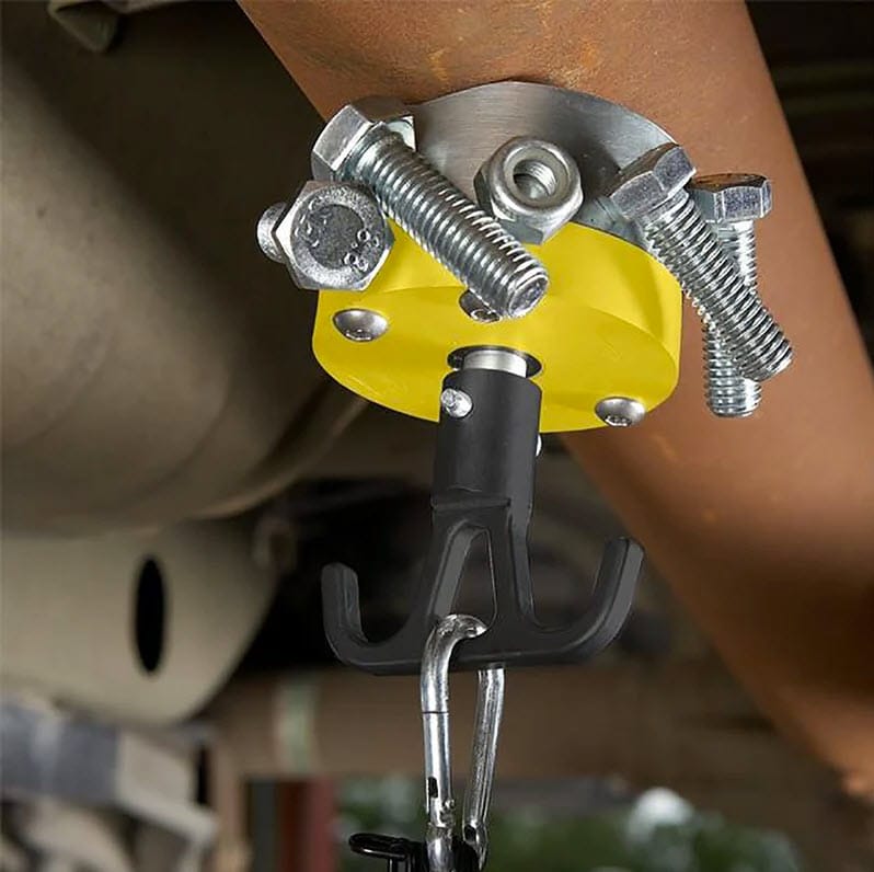 Magswitch magnetic hook holding metal bolts attached to a pipe