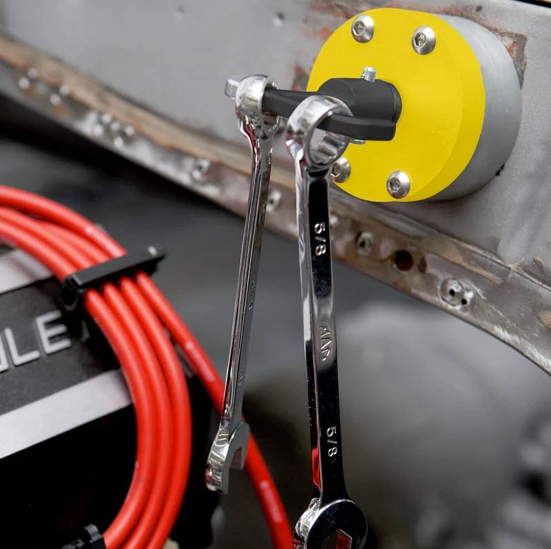 Magswitch magnetic tool holder mounted on a metal surface holding two wrenches