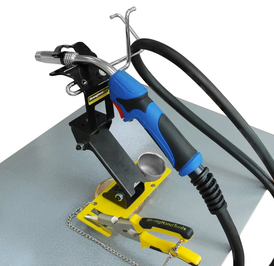 Strong Hand magnetic MIG welding torch stand with pliers on a metal surface