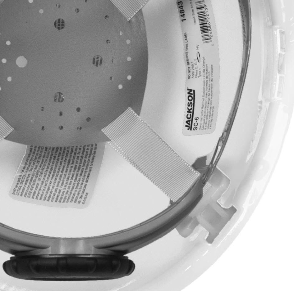 Interior view of Jackson Safety SC-6 hard hat suspension system with product information label