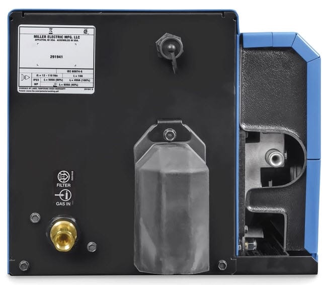 Rear view of Miller welding equipment showing gas inlet and technical specification label