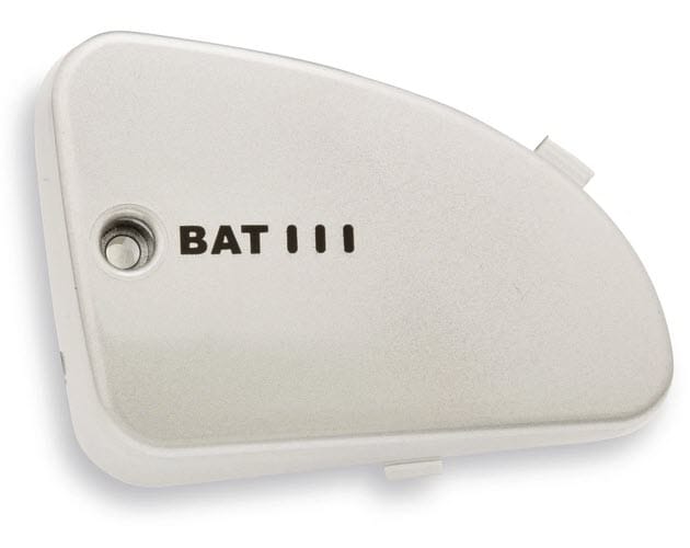 White plastic battery cover with BAT III label and screw hole